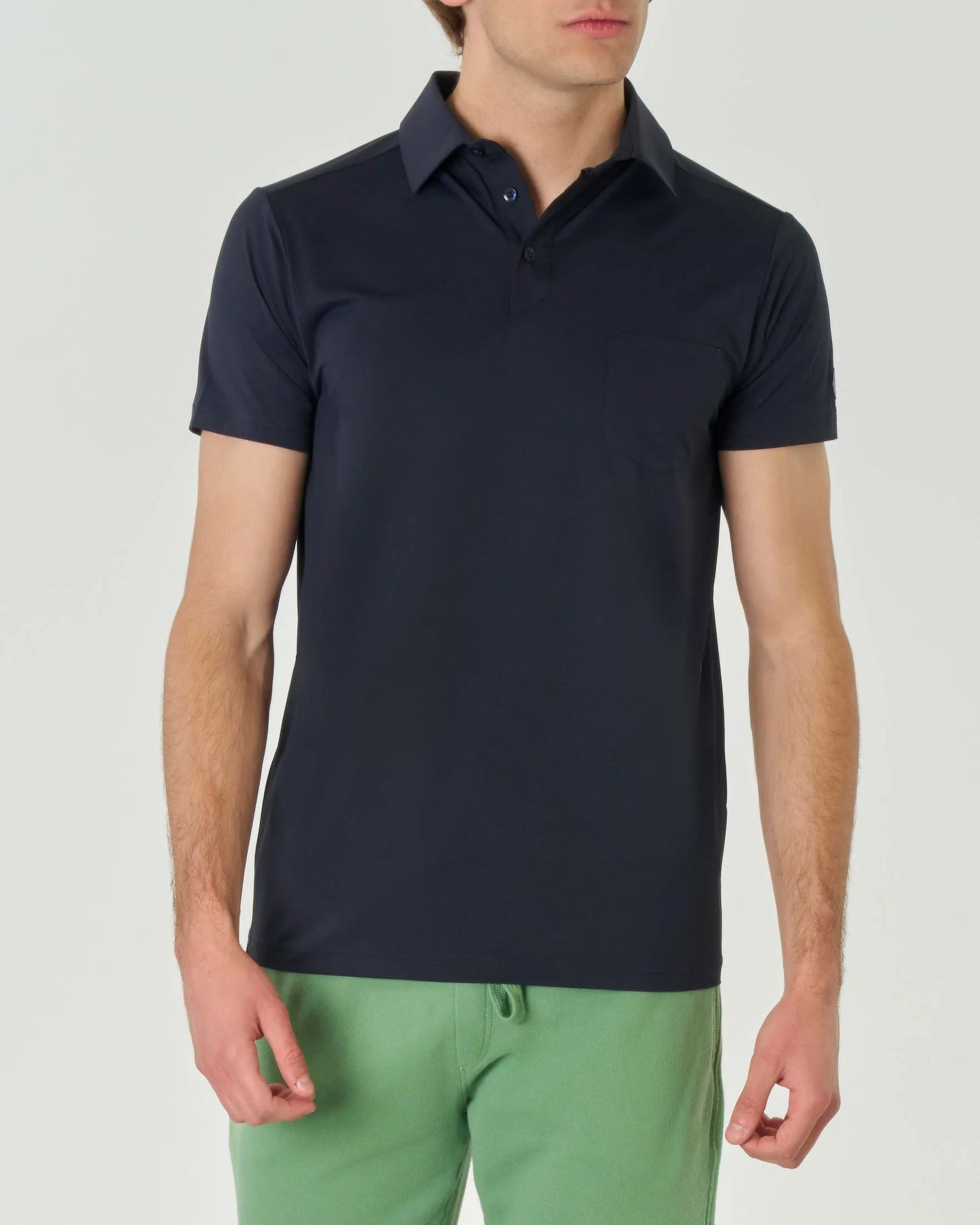 Polo blu in tessuto tecnico stretch con taschino sul petto